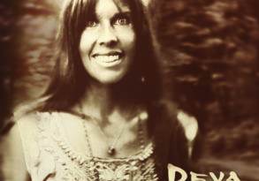 Vintage-style portrait of a smiling woman with long hair, wearing a patterned blouse. The word "Deva" is written in the bottom corner to indicate the artistic theme.