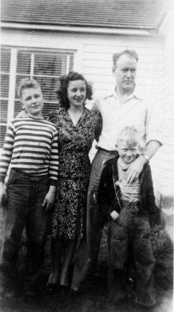 Family photo of Ken, Chuck, and parents (Geneva and Fred), circa 1944