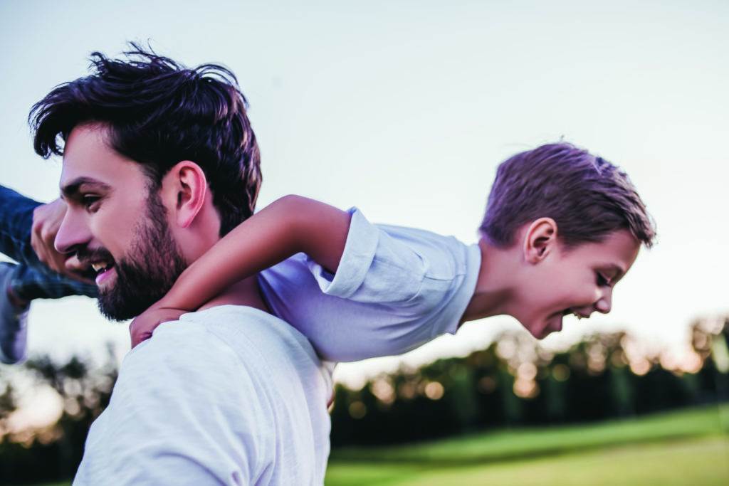 Dad and son having fun outdoors.