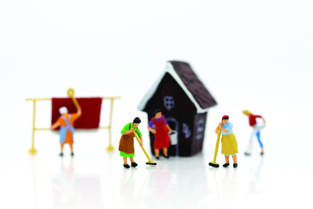 Miniature people: Housekeepers clean the house. Image use for cleaning occupations, business concept.