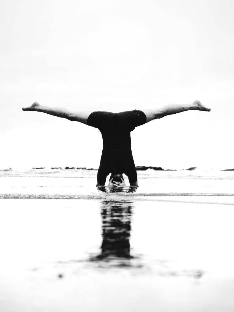 man is standing on his head