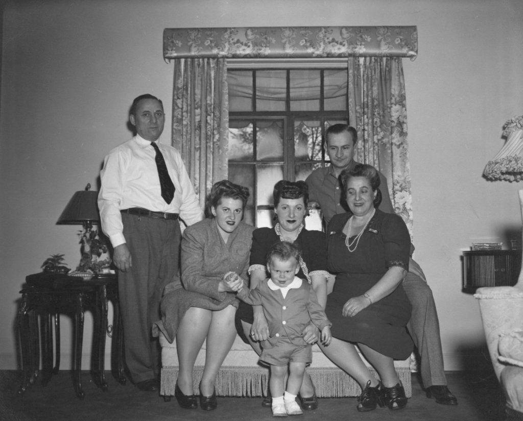 From left to right: Grandpa Abe, Aunt Sarah, Larry’s mother (holding Larry) and father (in the back), and Grandma Ida